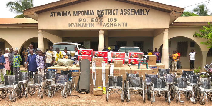 Atwima Mponua  DCE presents items and cash to (54) Persons with Disabilities 2022